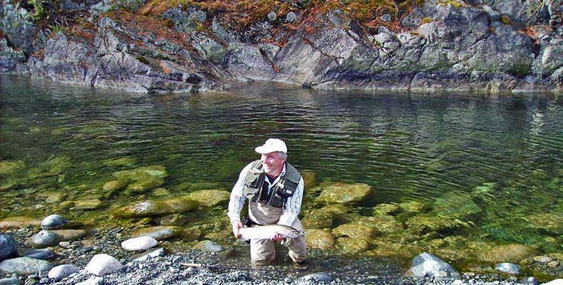 Wolfgang Fabisch with a good steelhead at fly fishing