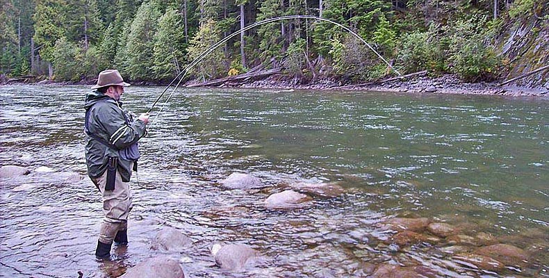Fritz is fighting a steelhead on the rock pool at the Copper River