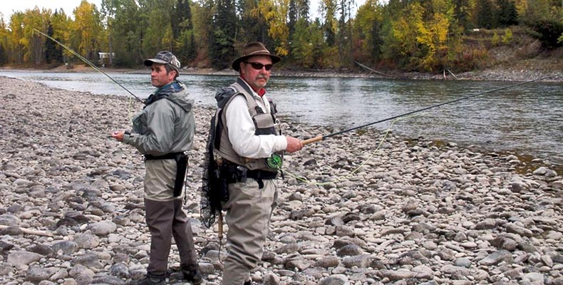 Two friends fly fishing at Bulkley in Smithers